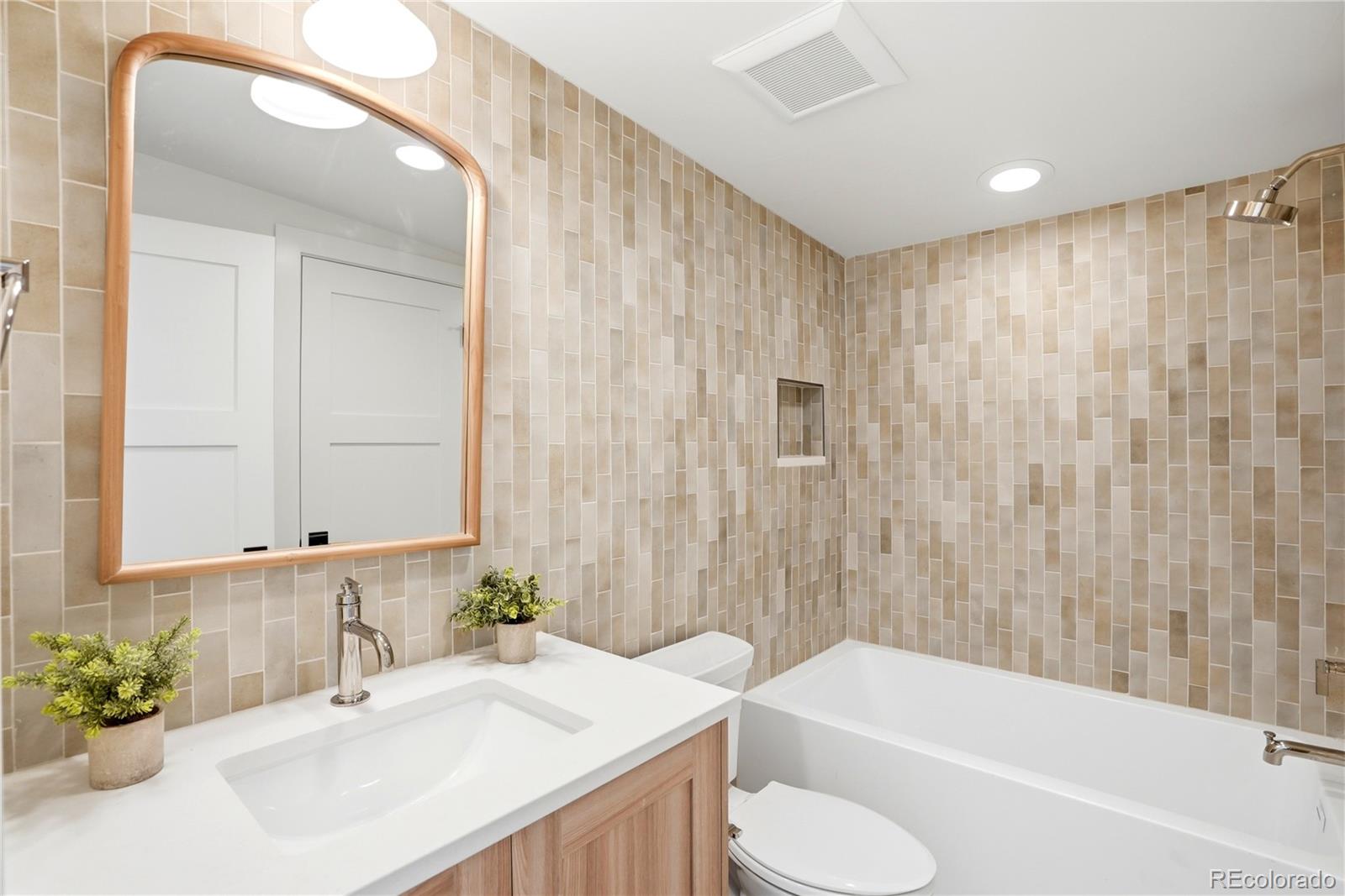 245 South Emerson Street Denver, CO 80209 - Photo 43 of 49 a bathroom with a sink toilet and shower