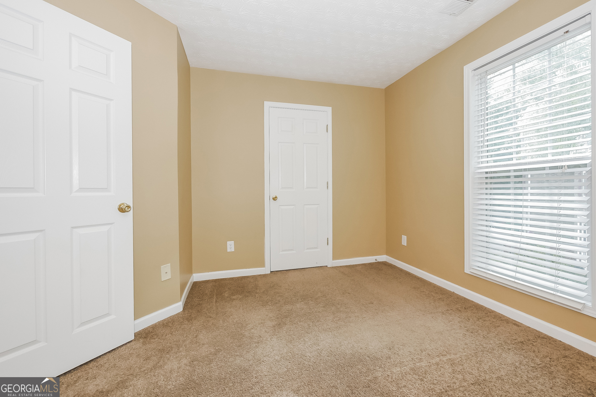 4468 Abram Way Conley, GA 30288 - Photo 12 of 17 a view of an empty room with a window