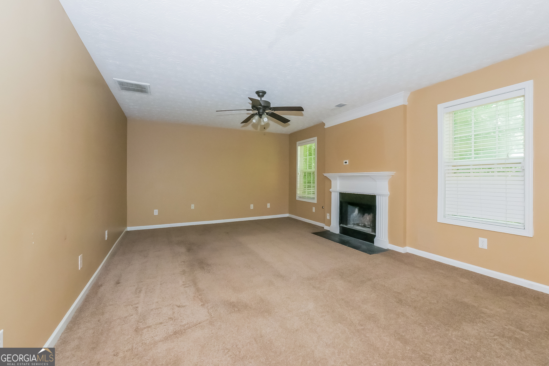 4468 Abram Way Conley, GA 30288 - Photo 2 of 17 a view of an empty room with a fireplace and a window