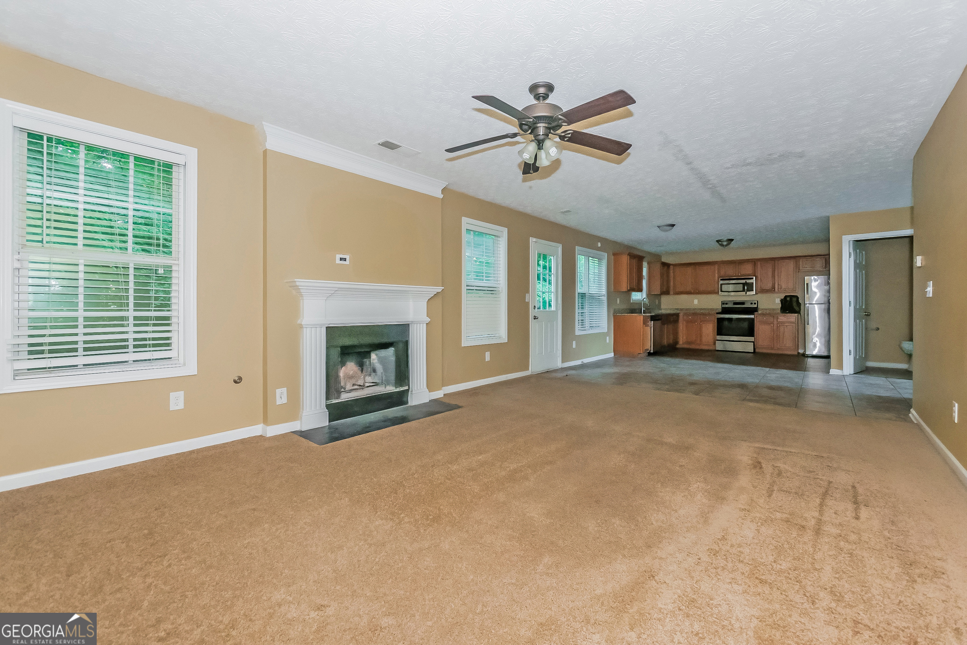 4468 Abram Way Conley, GA 30288 - Photo 4 of 17 a living room with furniture and a fireplace