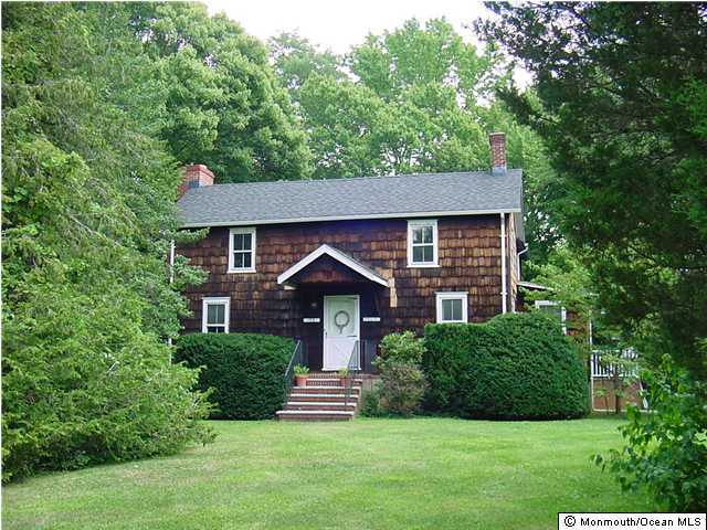 150 Stillwells Corner Road Freehold, NJ 07728 - Photo 1 of 3 a front view of a house with a yard