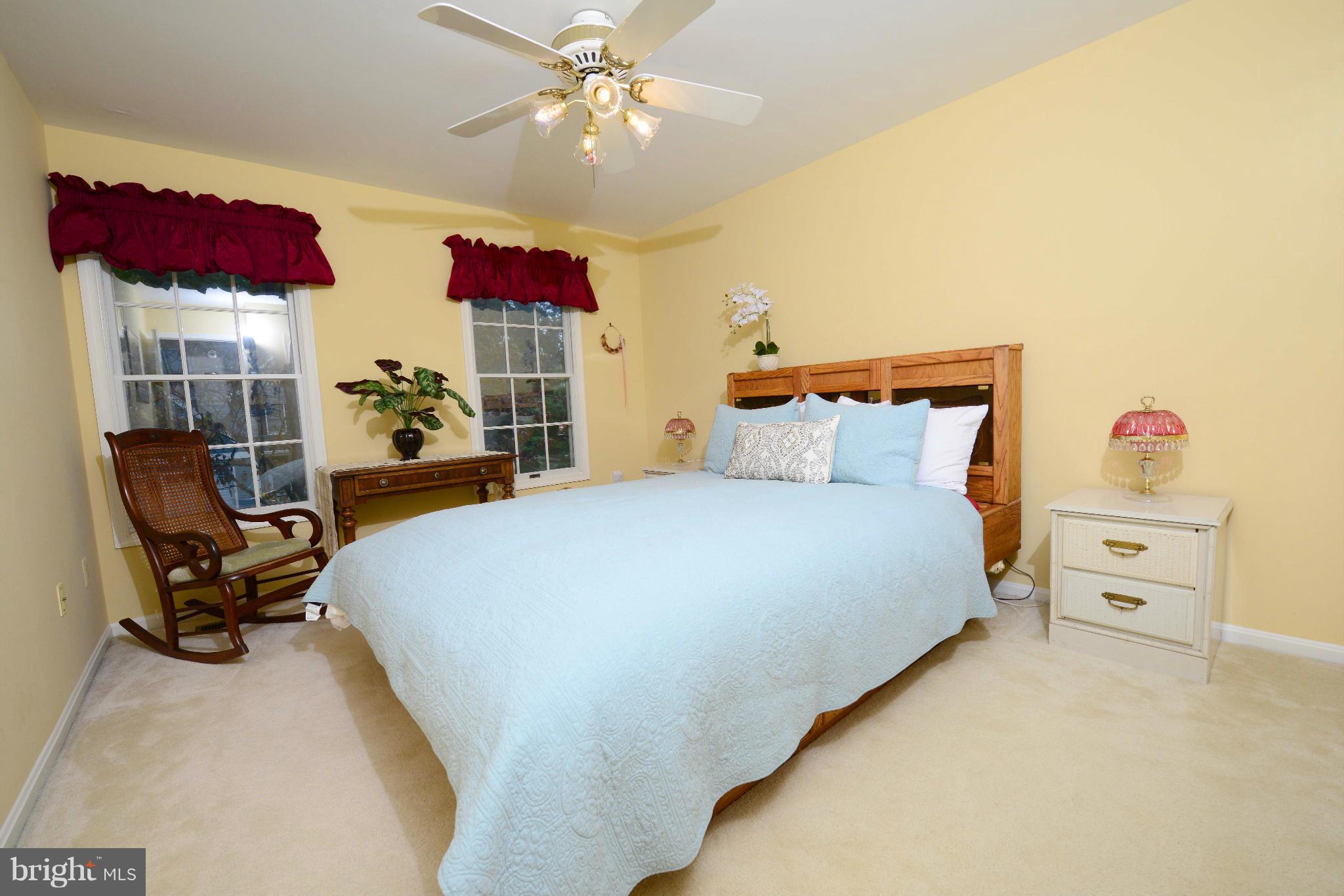 305 Riding Ridge Road Annapolis, MD 21403 - Photo 14 of 29 a bed room with a bed and a chair