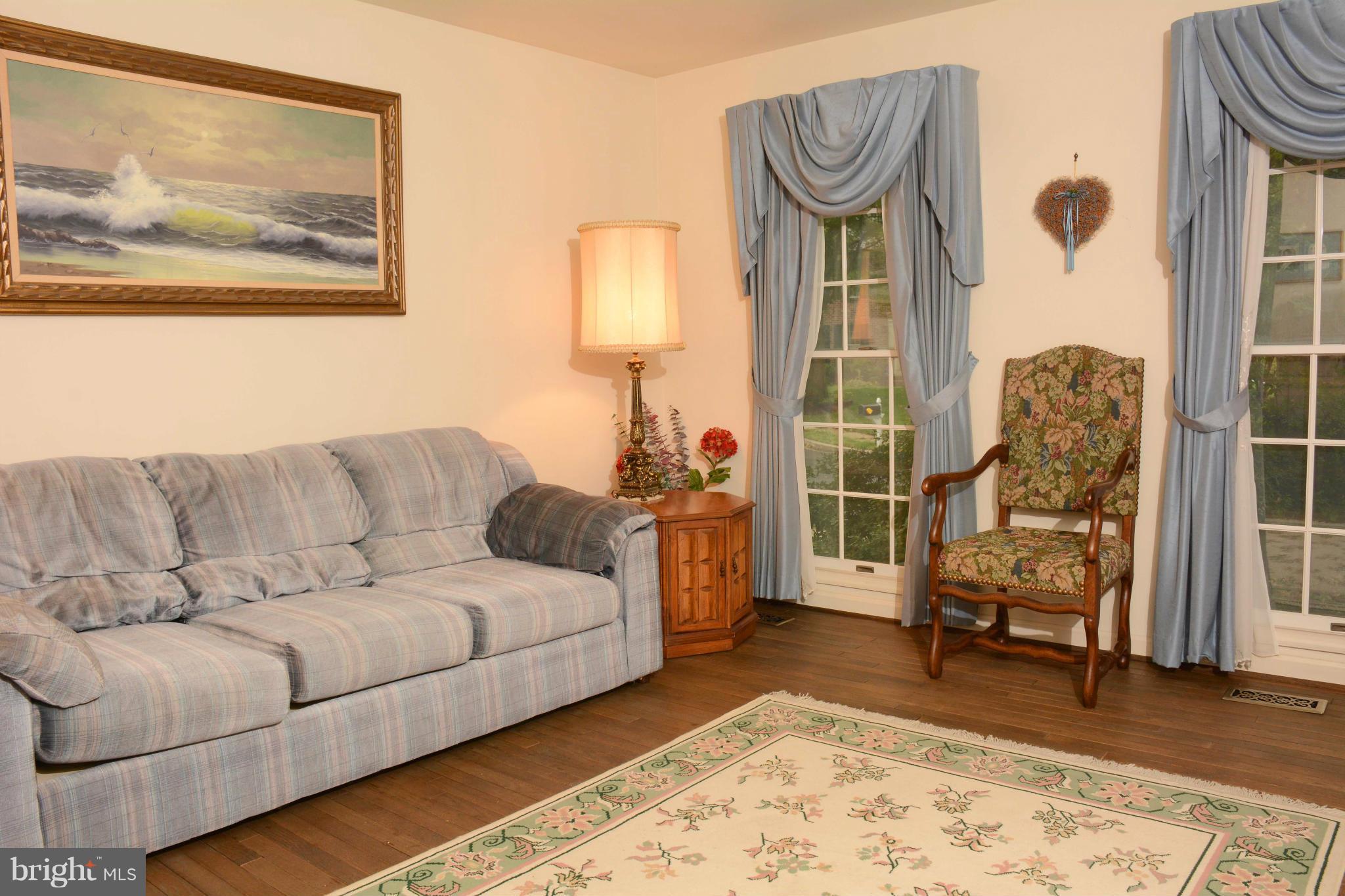 305 Riding Ridge Road Annapolis, MD 21403 - Photo 10 of 29 a living room with furniture and a wooden floor