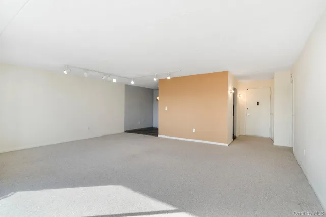 an empty room with entrance and door