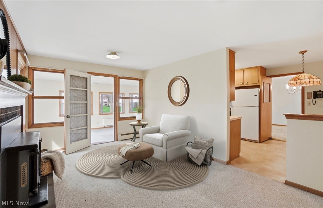 77 Warren Street Rittman, OH 44270 - Photo 11 of 41 Family room with fireplace, Virtually staged