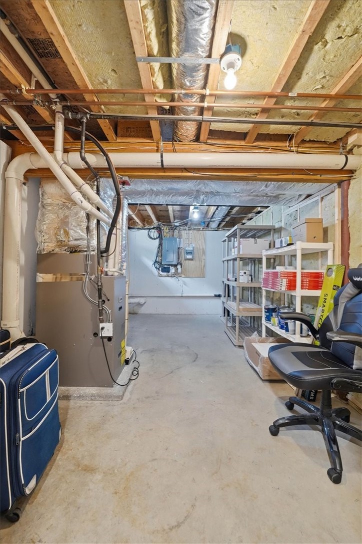 26 Davis Circle Warwick, RI 02886 - Photo 40 of 50 Unfinished mechanical room offers abundant storage for seasonal items and household essentials.