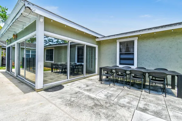 a house view with a backyard space