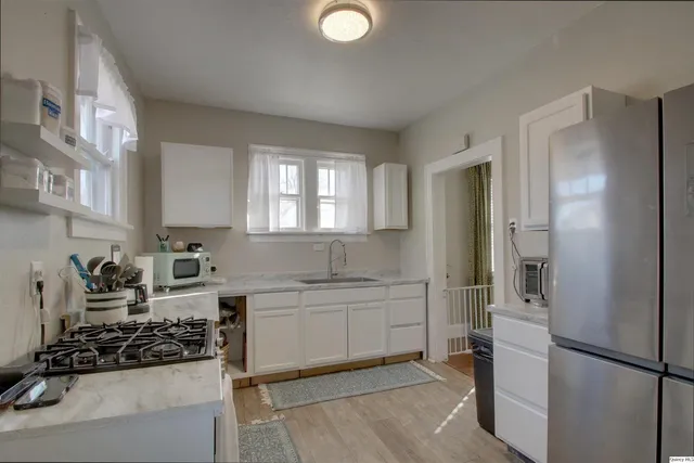 a kitchen with a sink and refrigerator