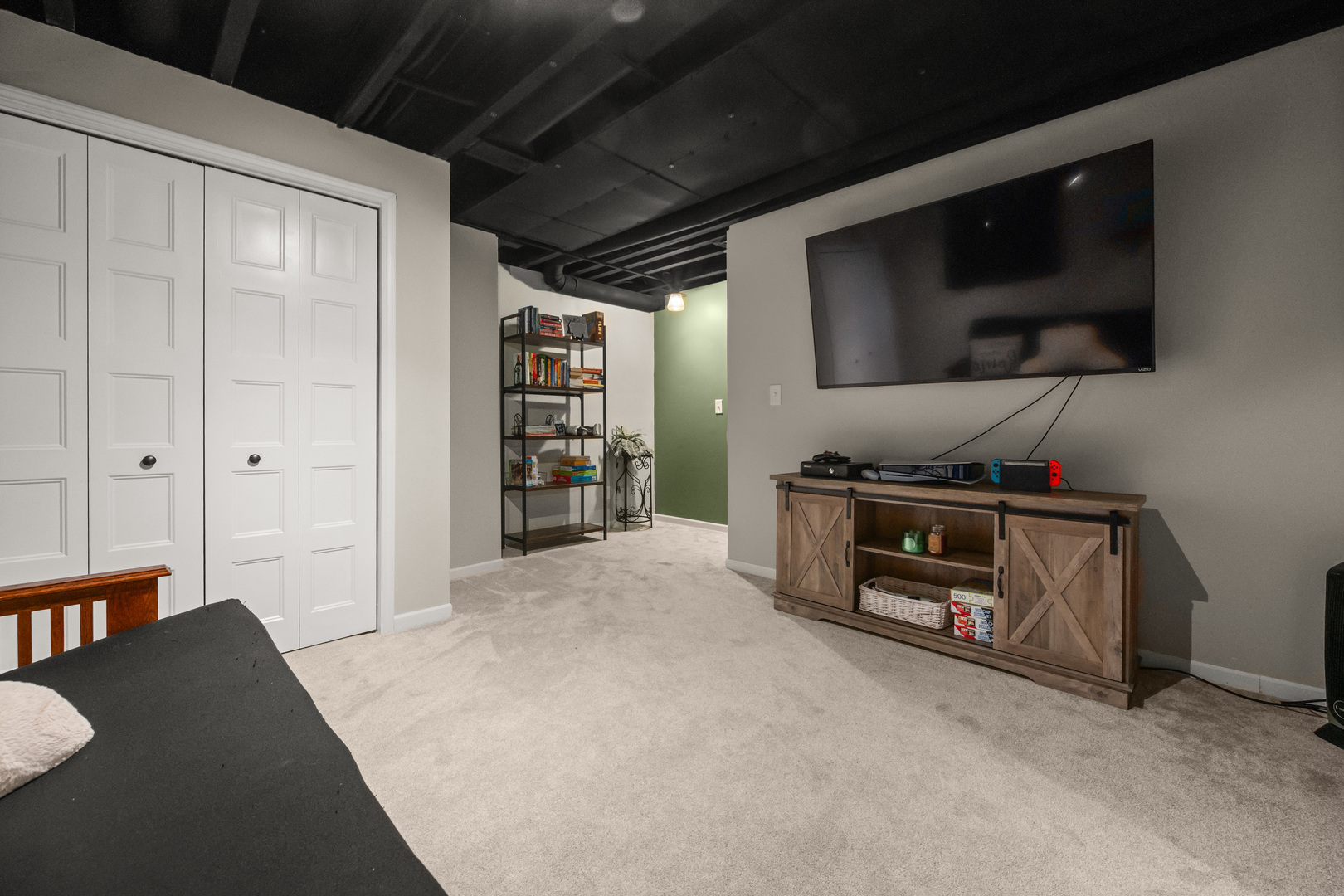710 Hawthorne Lane Genoa, IL 60135 - Photo 15 of 24 a living room with furniture and a flat screen tv