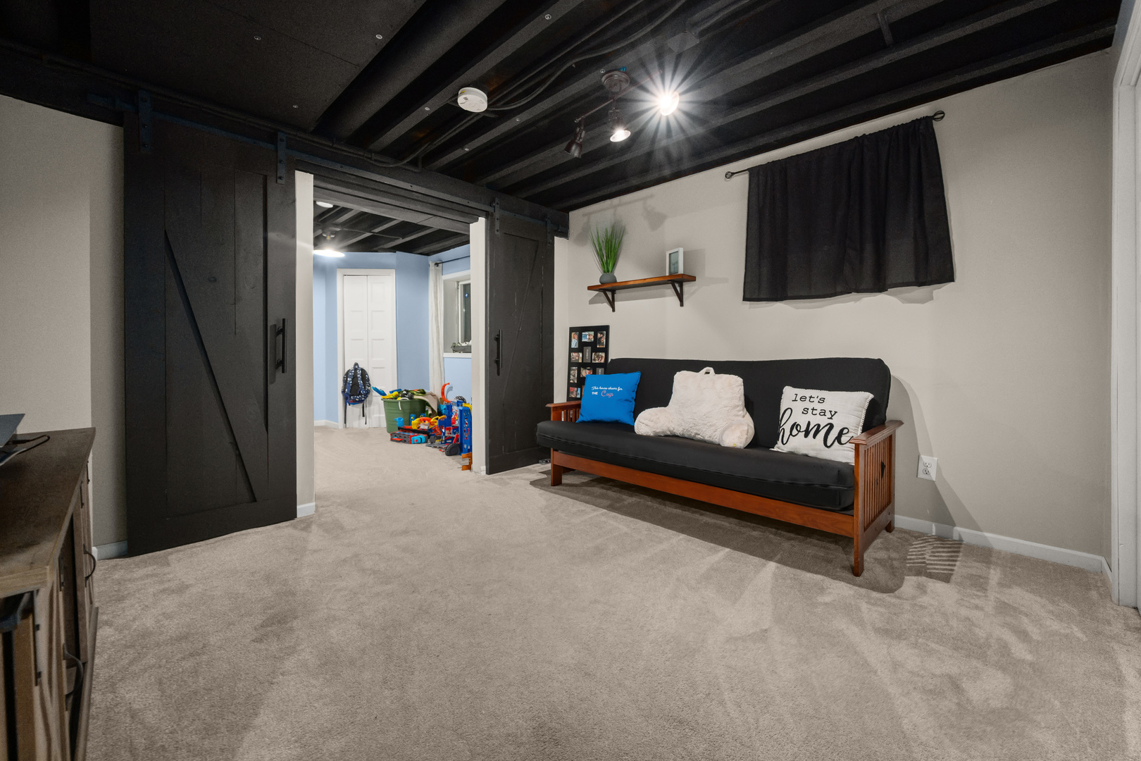 710 Hawthorne Lane Genoa, IL 60135 - Photo 16 of 24 a living room with furniture and a flat screen tv