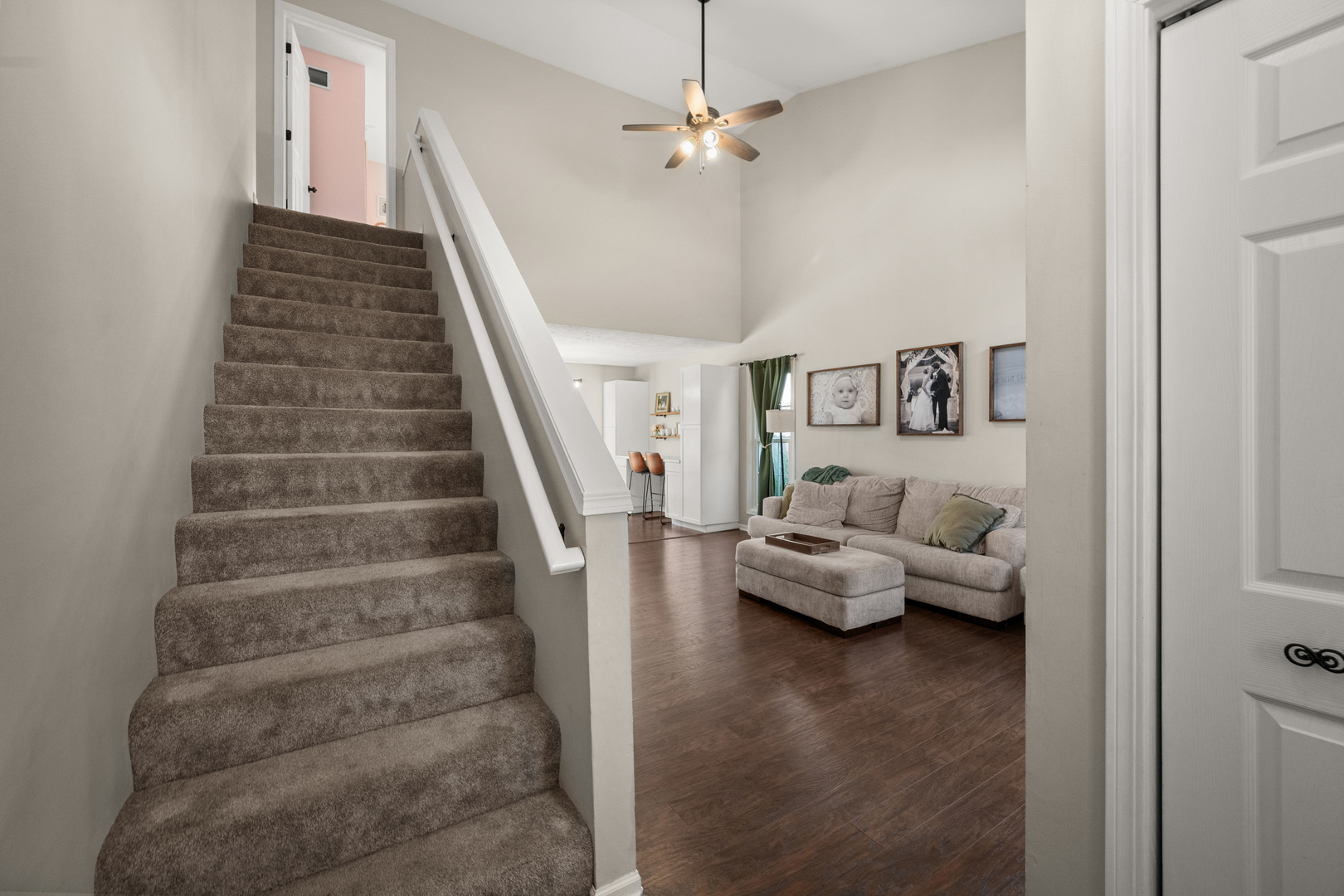 710 Hawthorne Lane Genoa, IL 60135 - Photo 3 of 24 a living room with furniture and stairs
