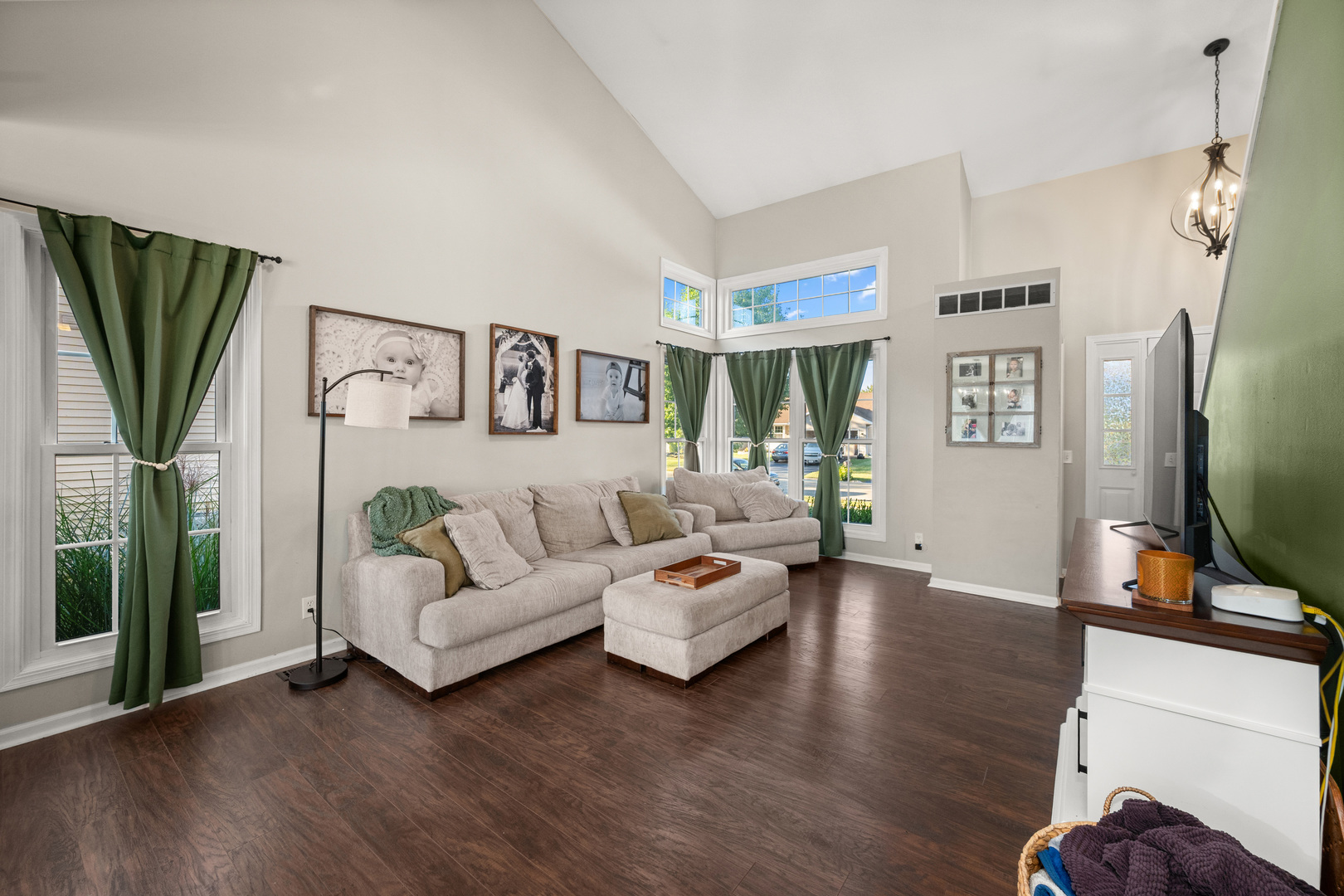 710 Hawthorne Lane Genoa, IL 60135 - Photo 5 of 24 a living room with furniture wooden floor and a flat screen tv