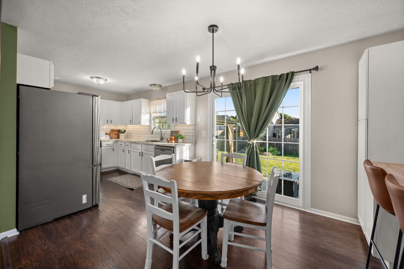 710 Hawthorne Lane Genoa, IL 60135 - Photo 7 of 24 a view of a dining room with furniture window and wooden floor