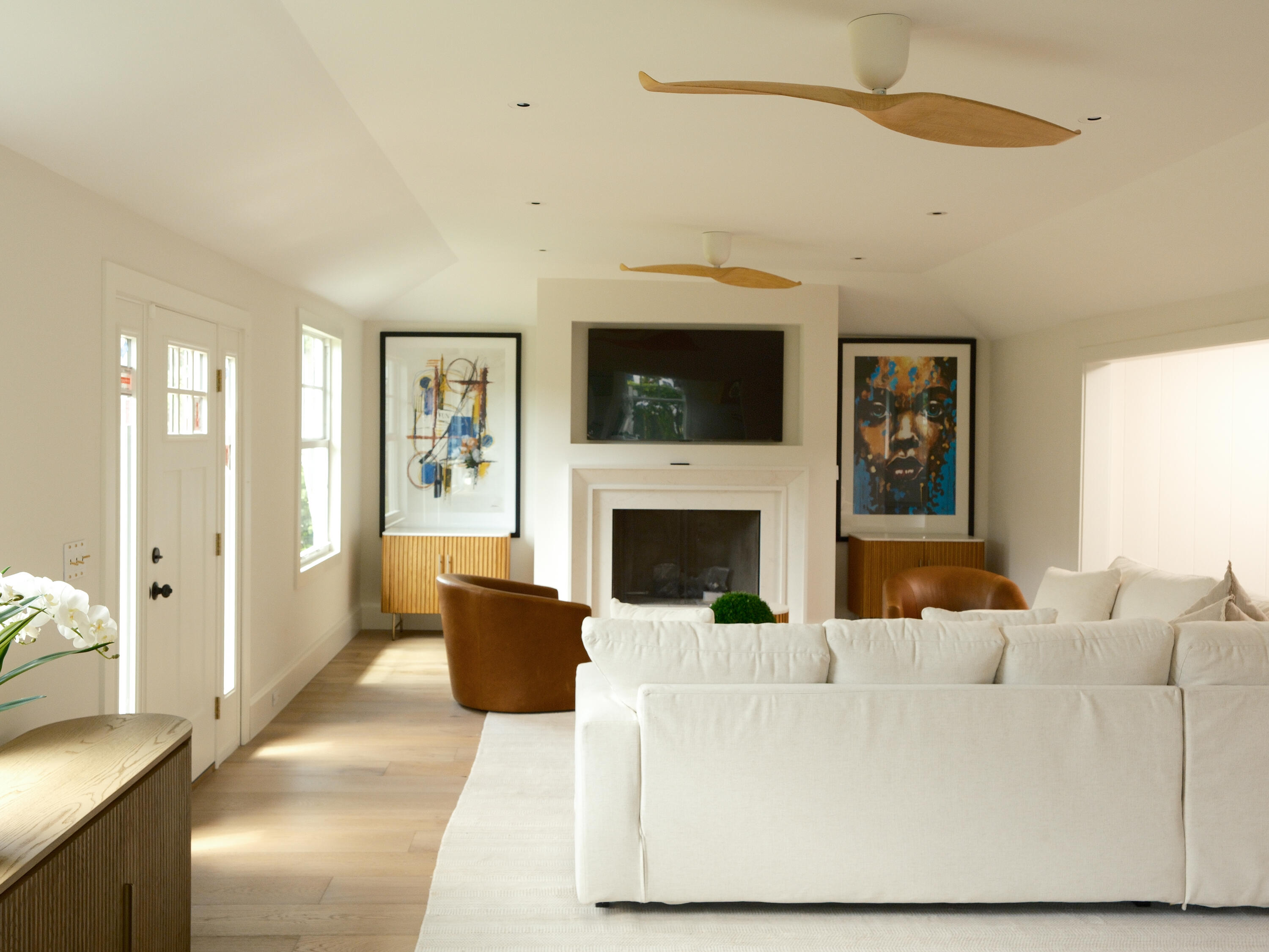 1017 Tamarind Road Delray Beach, FL 33483 - Photo 19 of 54 a living room with furniture a flat screen tv and a fireplace