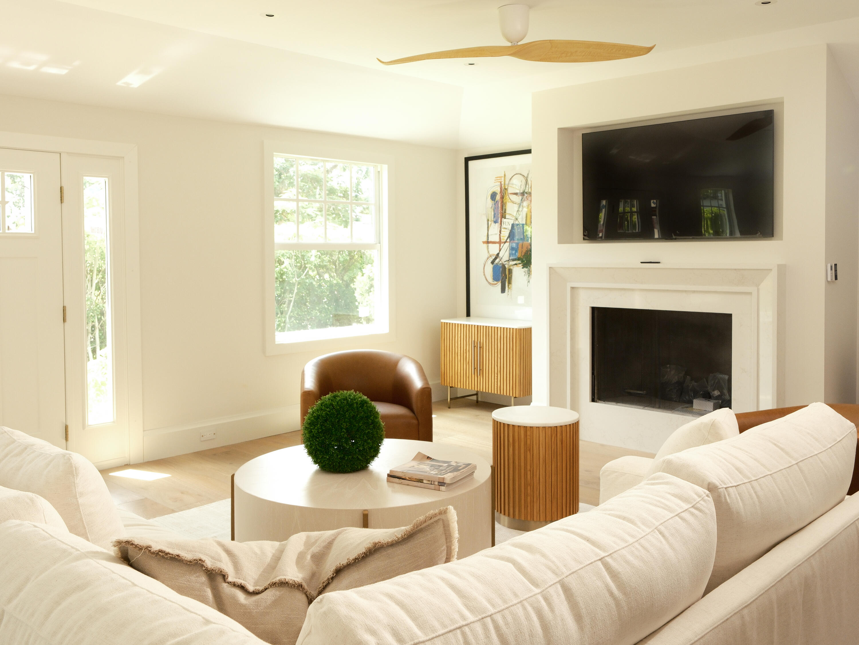 1017 Tamarind Road Delray Beach, FL 33483 - Photo 21 of 54 a living room with furniture a flat screen tv and a fireplace