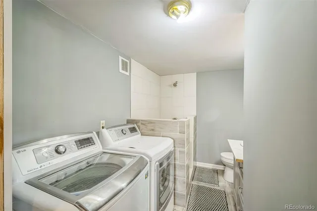 a utility room with dryer and washer