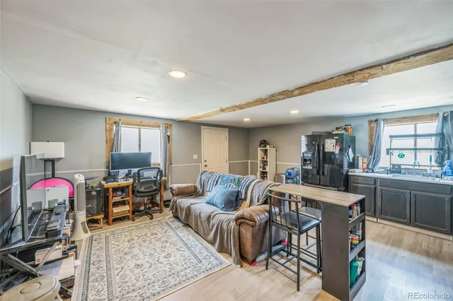a living room with furniture and window