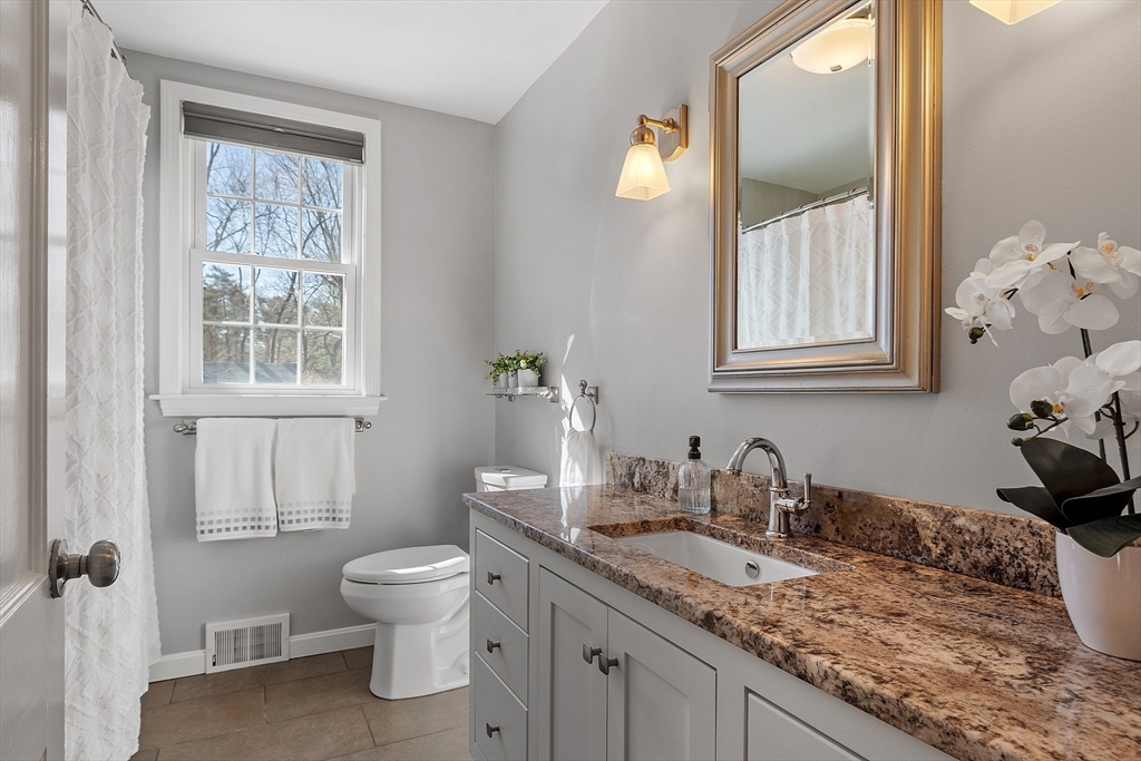 40 Bellevue Road Andover, MA 01810 - Photo 14 of 42 a bathroom with a granite countertop sink toilet and mirror