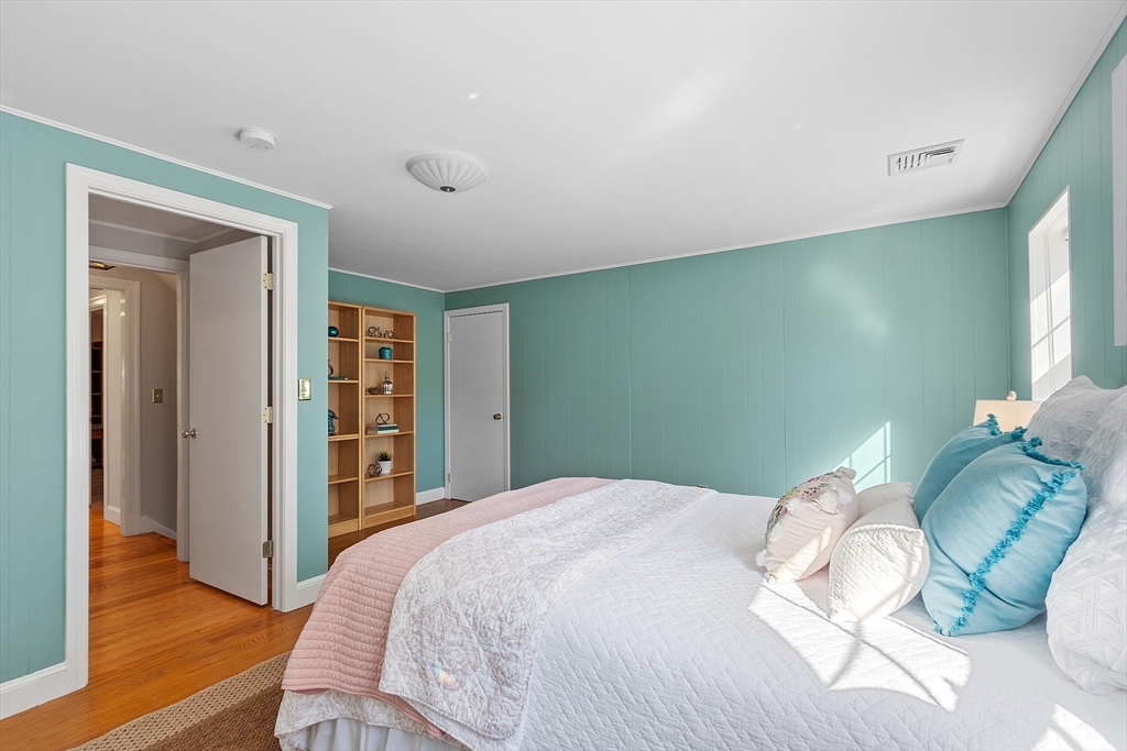 40 Bellevue Road Andover, MA 01810 - Photo 28 of 42 a bedroom with a bed and a wooden floor