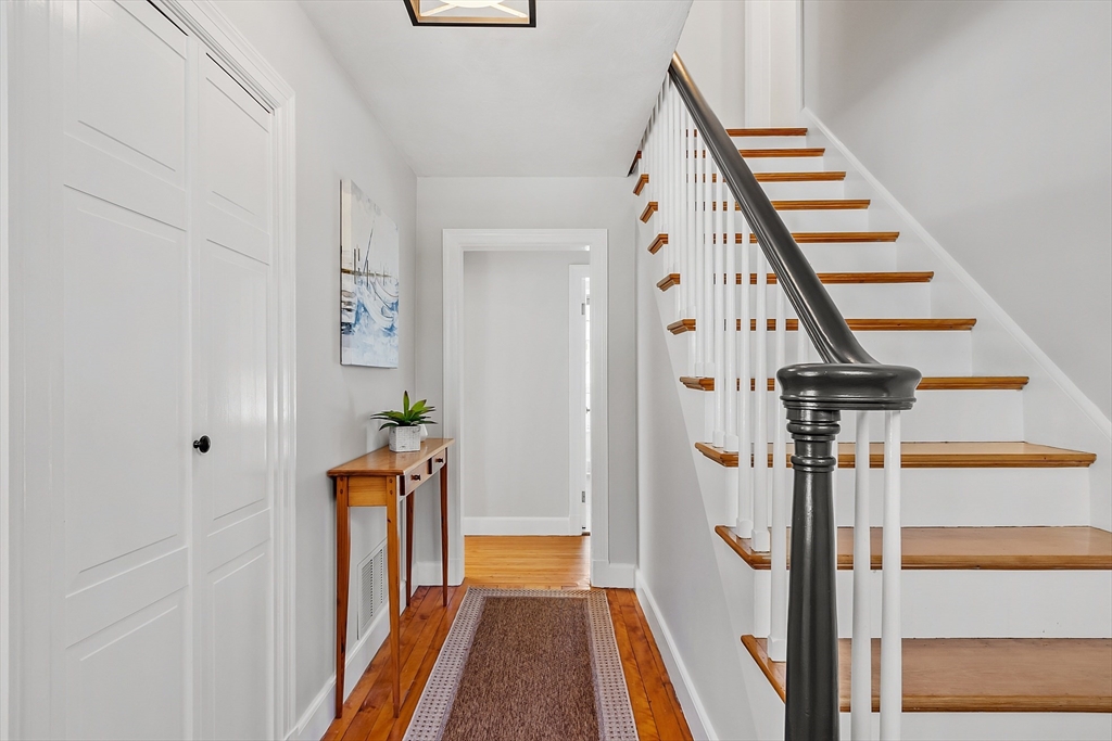 40 Bellevue Road Andover, MA 01810 - Photo 3 of 42 a view of a hallway with wooden floor and staircase