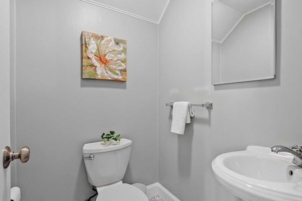 40 Bellevue Road Andover, MA 01810 - Photo 32 of 42 a white toilet sitting next to a bathroom sink