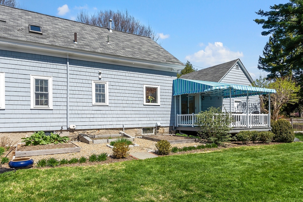 40 Bellevue Road Andover, MA 01810 - Photo 33 of 42 a front view of a house with a yard and outdoor seating