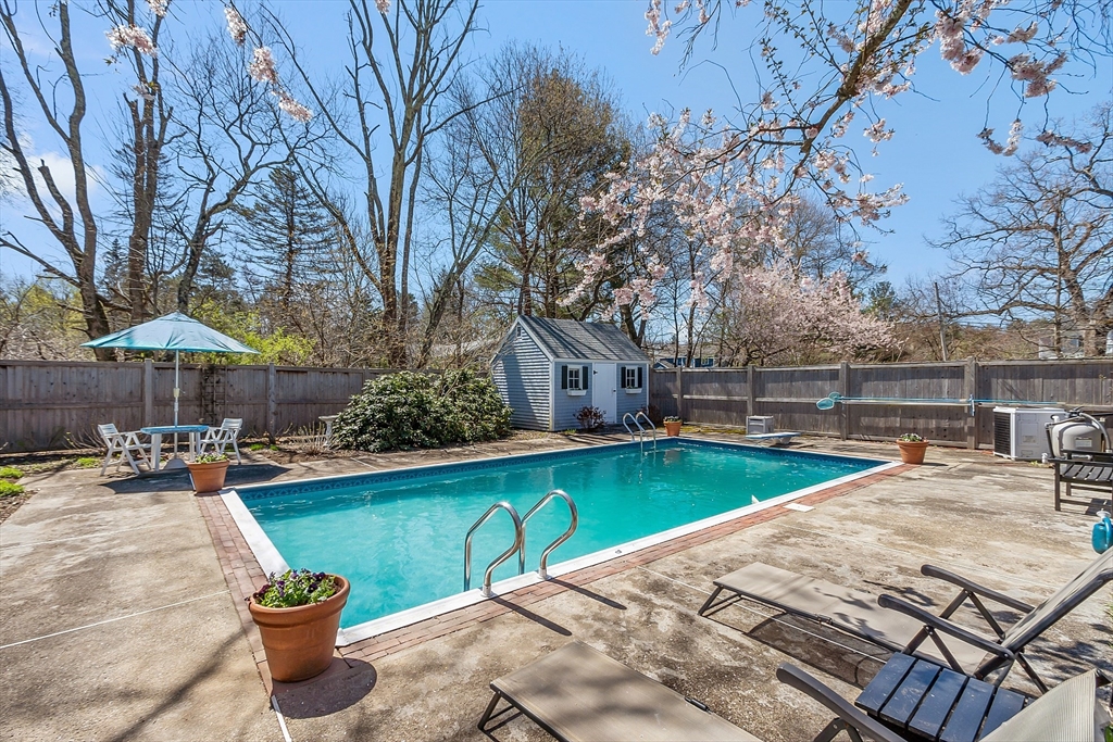 40 Bellevue Road Andover, MA 01810 - Photo 35 of 42 a view of a patio with chairs and umbrellas on a deck