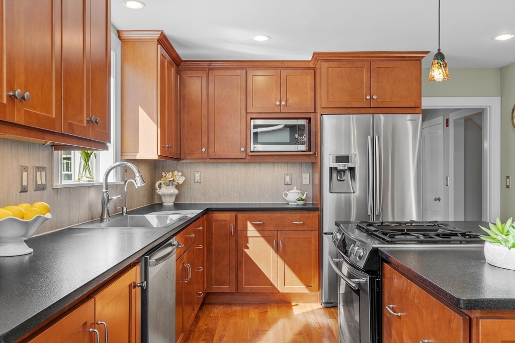 40 Bellevue Road Andover, MA 01810 - Photo 9 of 42 a kitchen with stainless steel appliances granite countertop a sink stove and cabinets