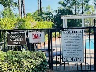 Lot I-14 Lot I-14 Mallard Lane Santa Rosa Beach, FL 32459 - Photo 5 of 15 a sign on the side of a building