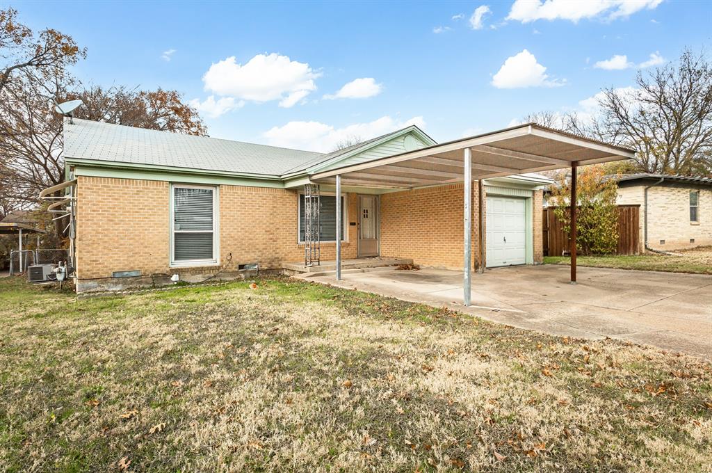 3311 Tooms Street Dallas, TX 75227 - Photo 1 of 38 a view of a house with a yard and garage