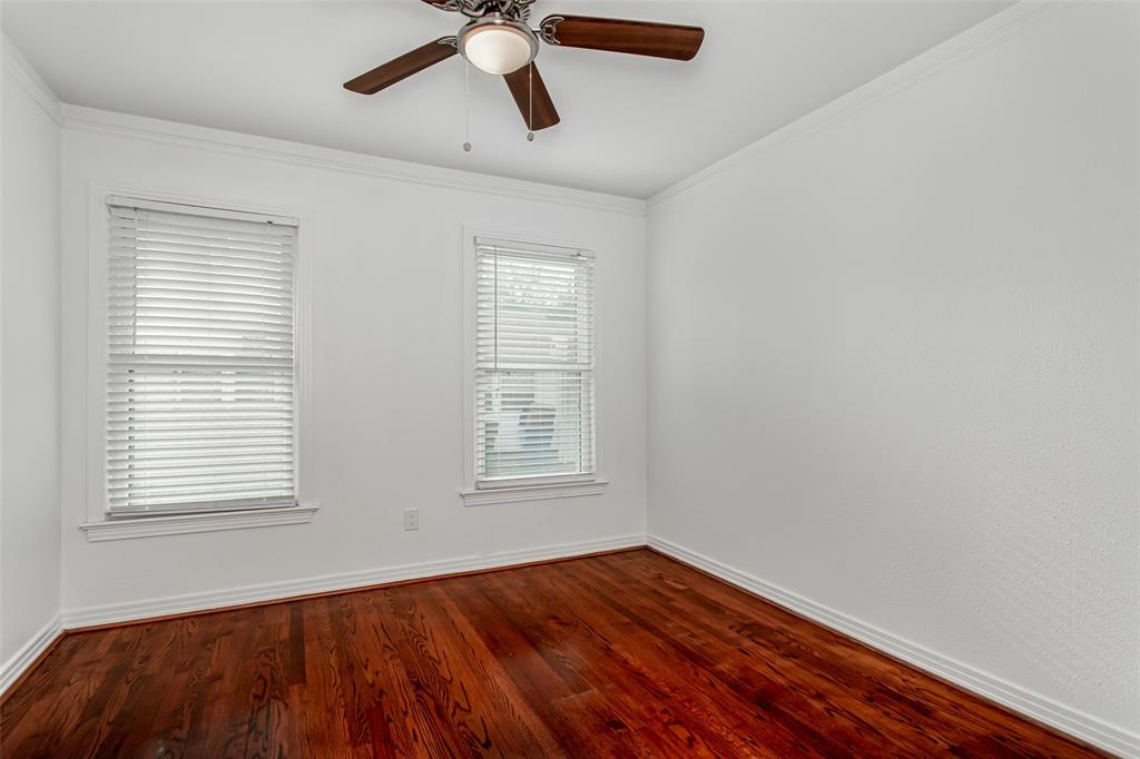 3311 Tooms Street Dallas, TX 75227 - Photo 29 of 38 a view of an empty room with wooden floor and a window