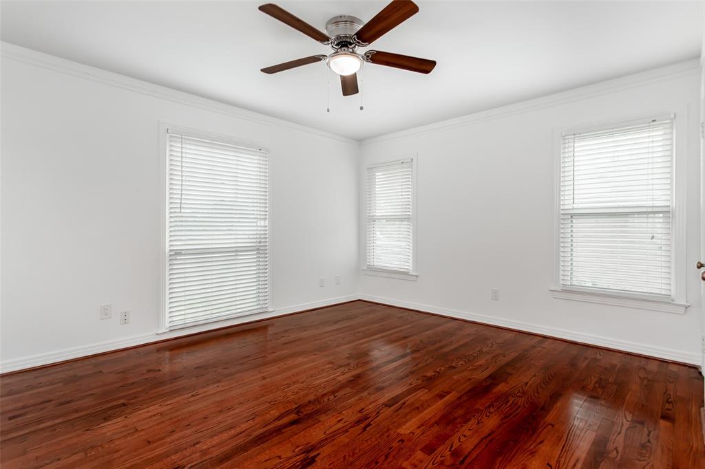 3311 Tooms Street Dallas, TX 75227 - Photo 31 of 38 a view of empty room with wooden floor and fan