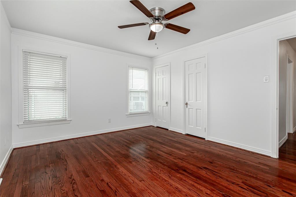 3311 Tooms Street Dallas, TX 75227 - Photo 32 of 38 a view of empty room with wooden floor and fan