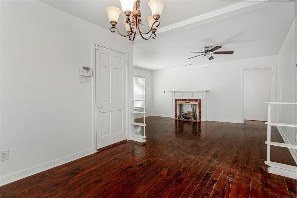 3311 Tooms Street Dallas, TX 75227 - Photo 5 of 38 a view of empty room with wooden floor