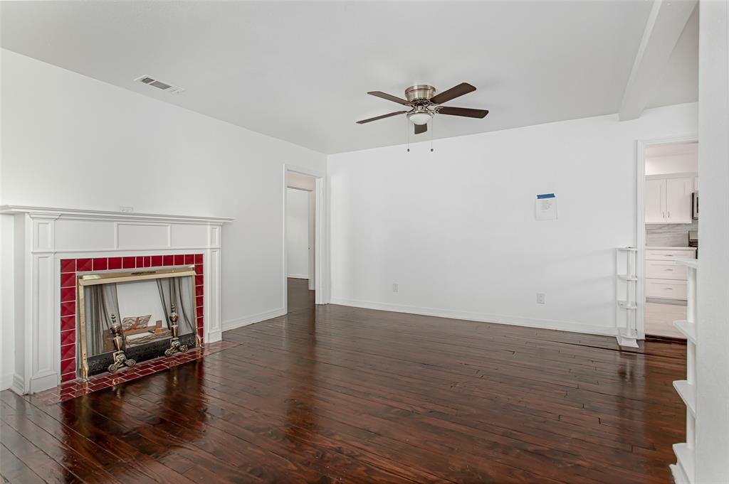 3311 Tooms Street Dallas, TX 75227 - Photo 6 of 38 a view of empty room with wooden floor and fan