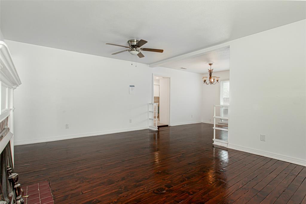 3311 Tooms Street Dallas, TX 75227 - Photo 9 of 38 a view of a room with wooden floor and ceiling fan