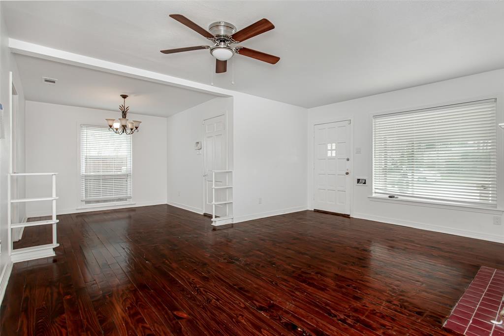 3311 Tooms Street Dallas, TX 75227 - Photo 10 of 38 wooden floor in an empty room with a window