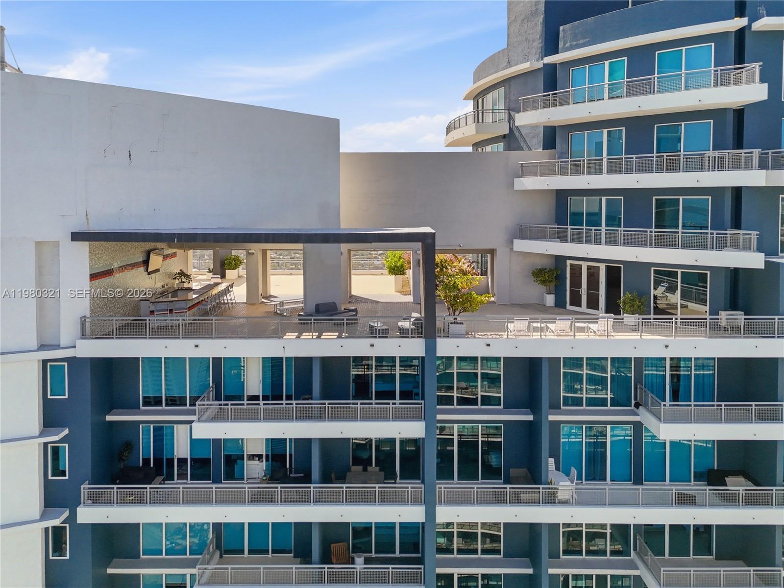 60 Southwest 13th Street, Unit 4414 Miami, FL 33130 - Photo 26 of 56 a view of a large building with a lot of windows