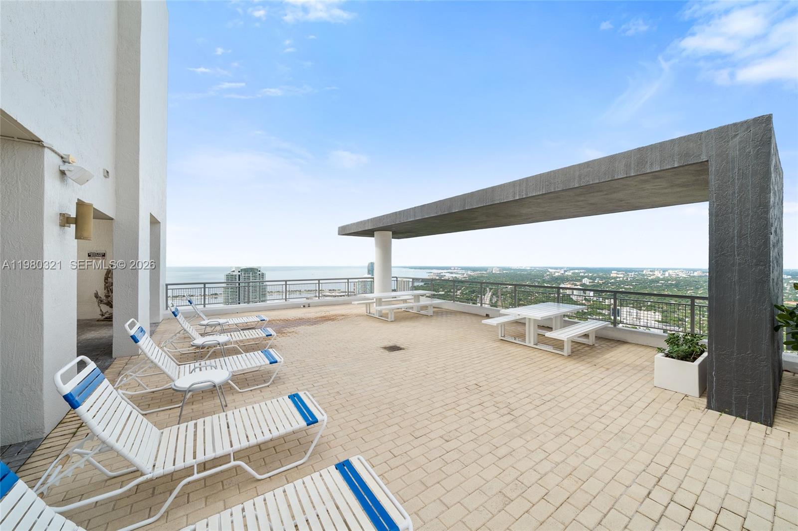 60 Southwest 13th Street, Unit 4414 Miami, FL 33130 - Photo 28 of 56 a view of swimming pool with outdoor seating and city view