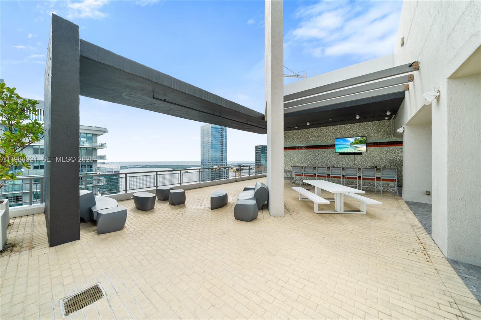 60 Southwest 13th Street, Unit 4414 Miami, FL 33130 - Photo 31 of 56 a view of a swimming pool with furniture