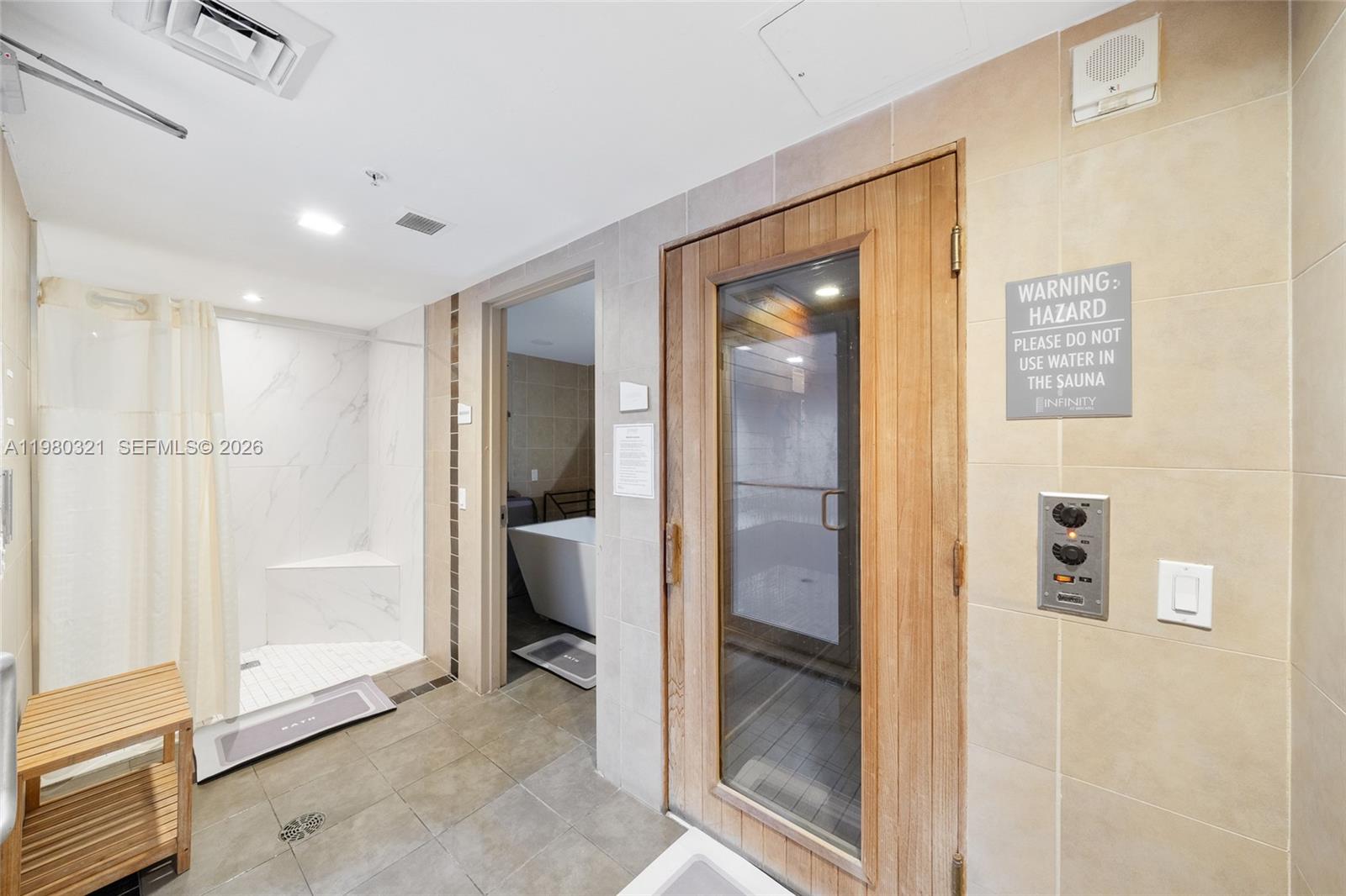 60 Southwest 13th Street, Unit 4414 Miami, FL 33130 - Photo 38 of 56 a view of a hallway with wooden shelves