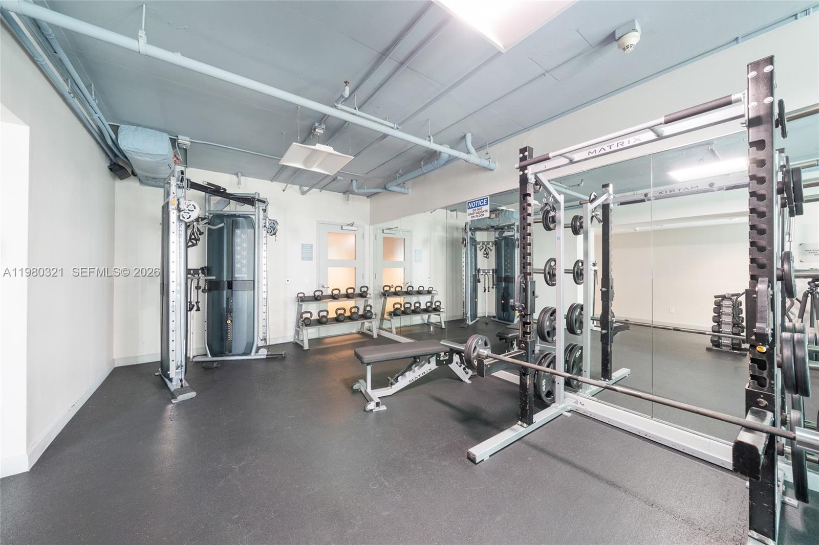 60 Southwest 13th Street, Unit 4414 Miami, FL 33130 - Photo 41 of 56 a view of a room with gym equipment
