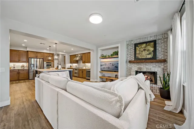 a living room with furniture fireplace and flat screen tv