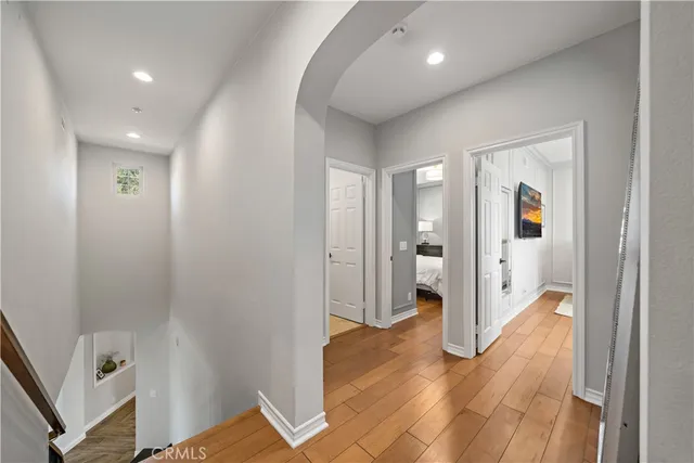 a bedroom with a bed and a potted plant