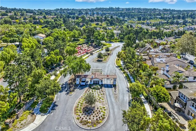 a view of a pool with a table and chairs