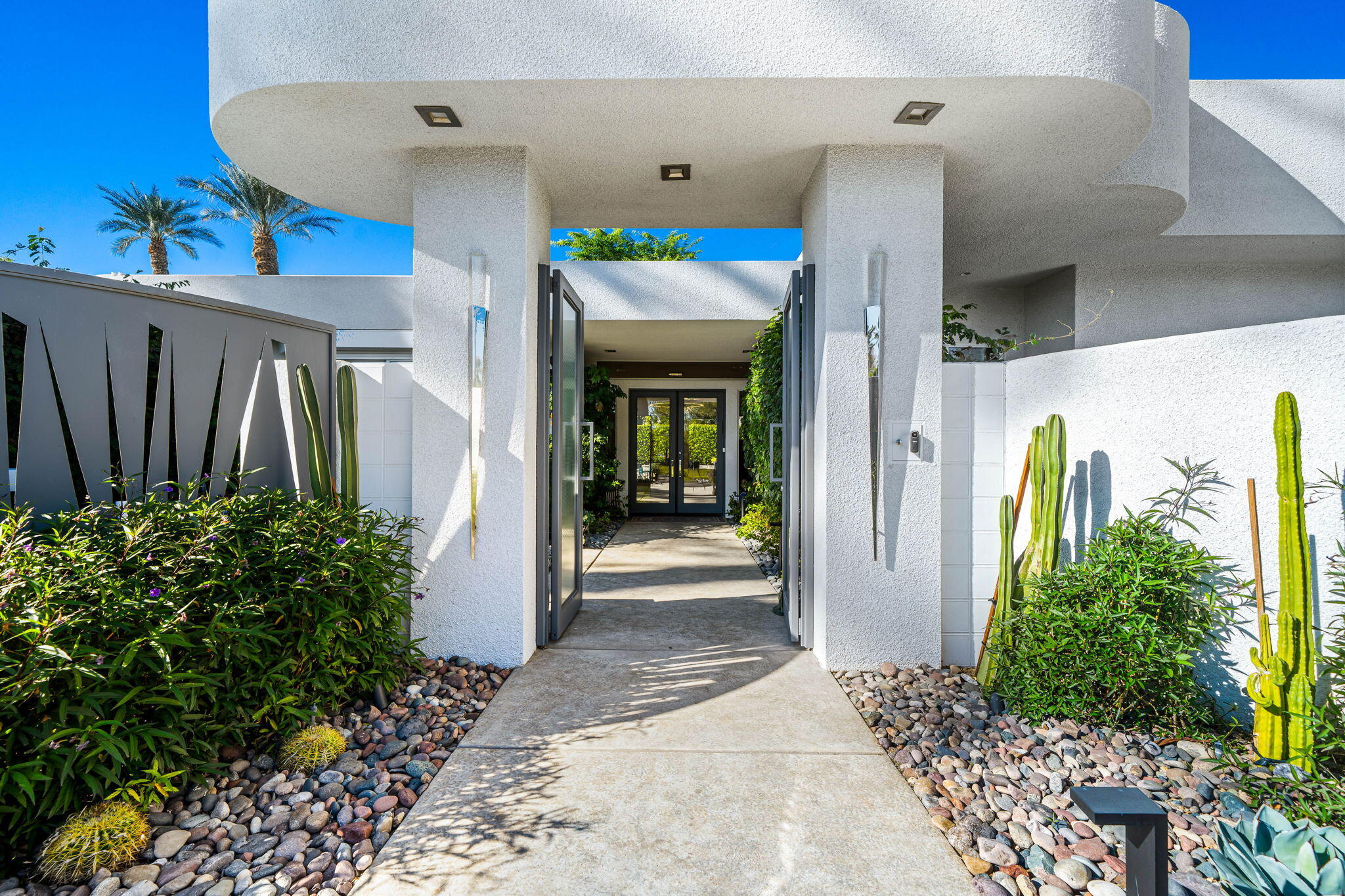 105 Waterford Circle Rancho Mirage, CA 92270 - Photo 11 of 76 a front view of a house with a porch