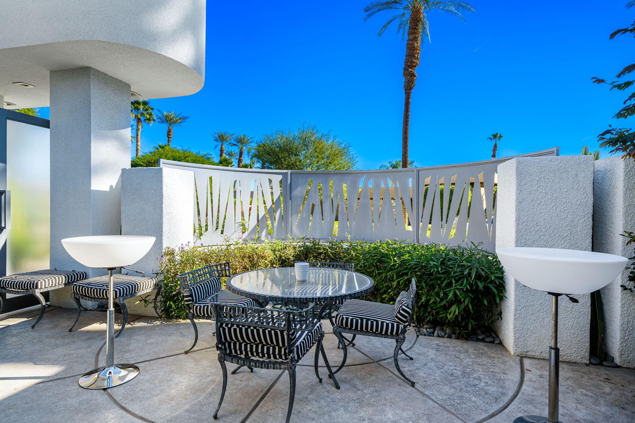 105 Waterford Circle Rancho Mirage, CA 92270 - Photo 14 of 76 a view of a chairs and table in patio