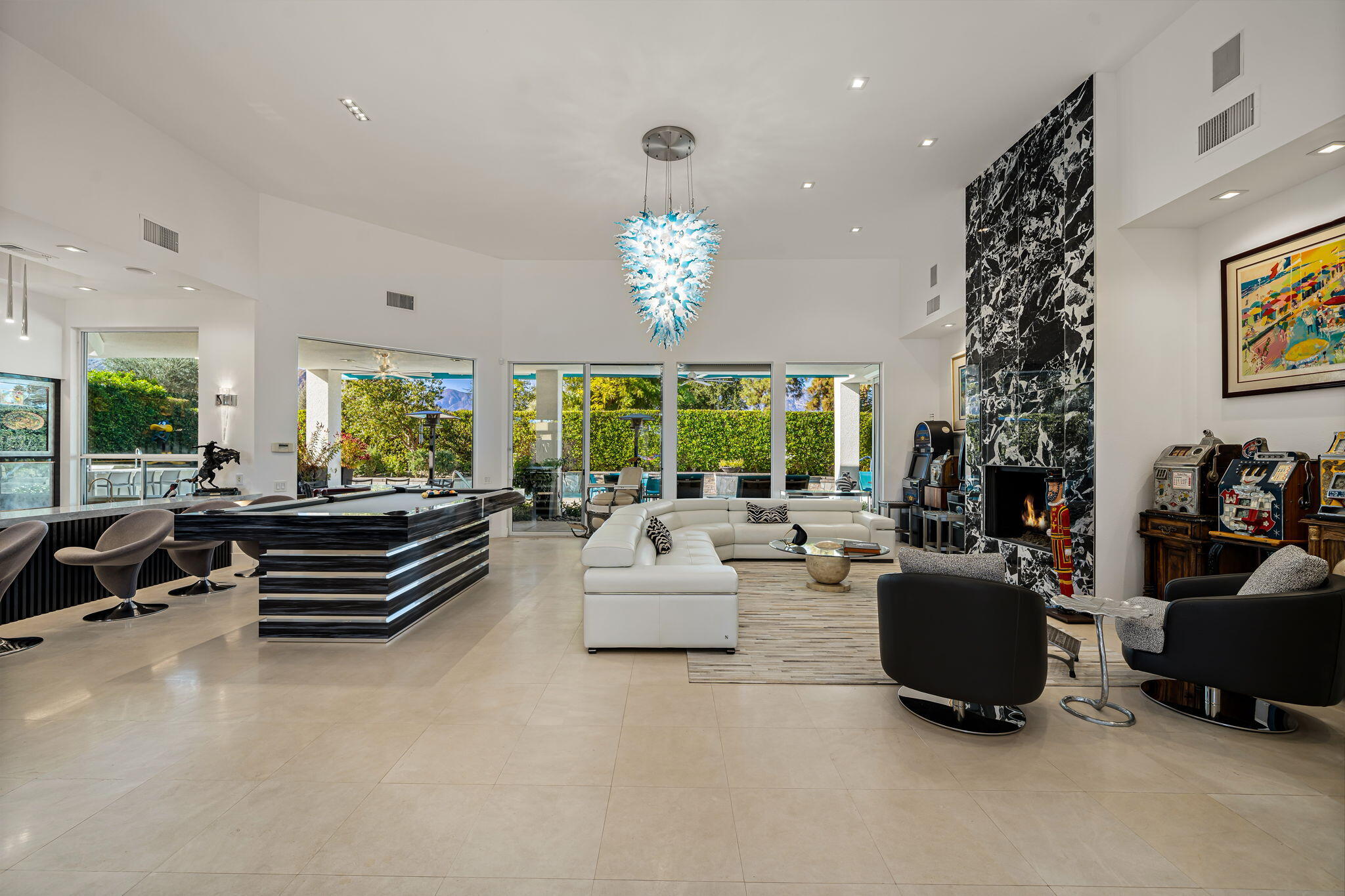 105 Waterford Circle Rancho Mirage, CA 92270 - Photo 17 of 76 a living room with furniture and a large window