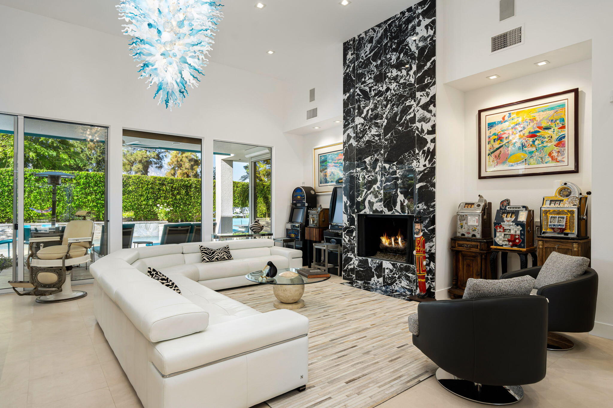 105 Waterford Circle Rancho Mirage, CA 92270 - Photo 19 of 76 a living room with fireplace furniture and a large window