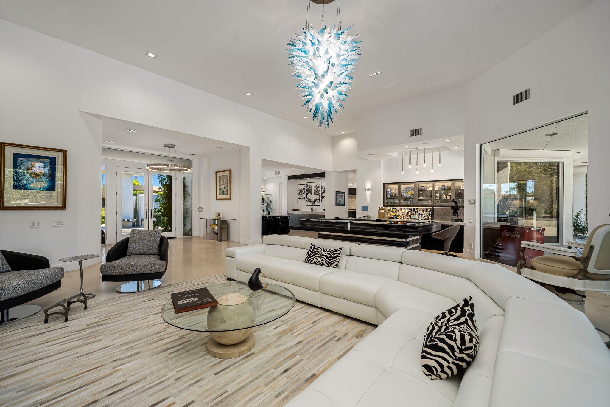 105 Waterford Circle Rancho Mirage, CA 92270 - Photo 22 of 76 a living room with furniture or chandelier and a wooden floor